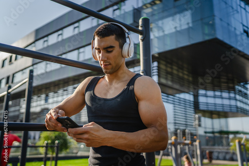 One man caucasian young male stand at outdoor open training park gym