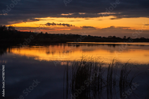 sunset over the lake.tranquil landscape © alipko