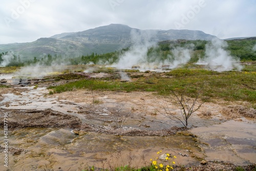 Idyllic landscape of mist emanating from Iceland geysers © Wirestock