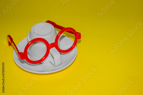 Pareidolia. Pareidoll illusion. Glasses and cup. Cup depicting a man with glasses. The cup represents a person in glasses.