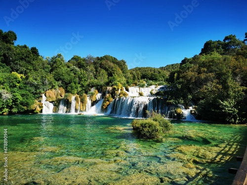 Beautiful waterfalls surrounded by green vegetation in Krka National Park. Dalmatia  Croatia.
