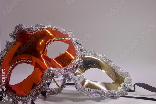 Red and silver carnival masks on the white background
