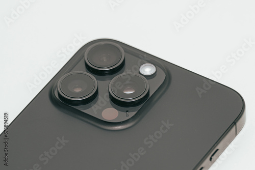 Closeup view of mobile phone with three cameras
