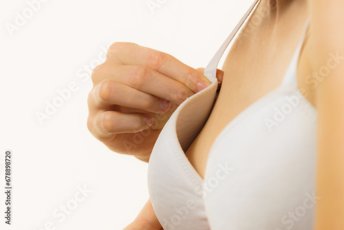 Female wearing too big bra photo