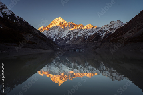 View of Hooker lake in front and Mt.Cook, the highest peak of New Zealand, in the background, during the sunset. photo