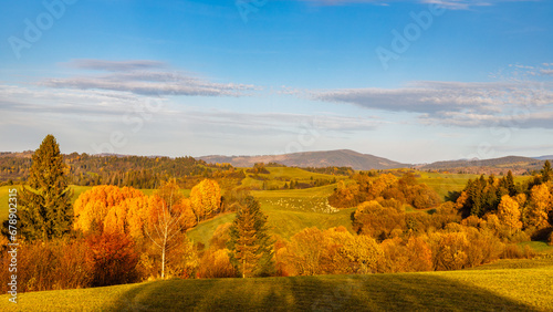 Fototapeta Naklejka Na Ścianę i Meble -  Autumn sunny rural landscape with mountains at background. The Orava region of Slovakia, Europe.