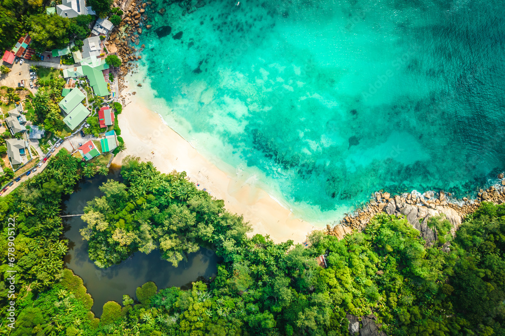 Aerial view Top down seashore. Beautiful azure sea surface in sunny day summer background Amazing seascape top view seacoast at Anse Solei Beach, Mahe Seychelles Aerial view Top down seashore. Beautiful azure sea surface in sunny day summer background Amazing seascape top view seacoast at Anse Solei Beach, Mahe Seychelles
