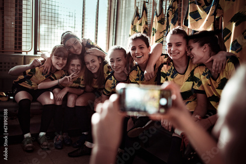 Youth Soccer Team posing for picture in locker room photo