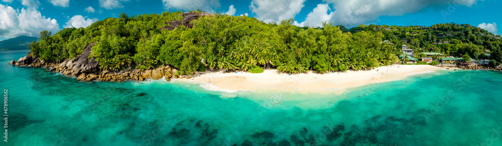 Panorama of Paradise Sunny beach with palms and turquoise sea. Summer vacation and tropical beach concept. Seyshelles, Anse Solei Panorama of Paradise Sunny beach with palms and turquoise sea. Summer vacation and tropical beach concept. Seyshelles, Anse Solei