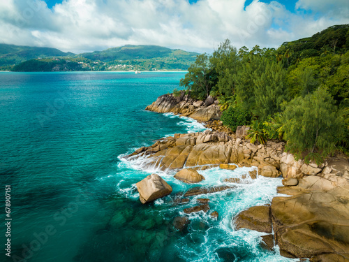 Big granite rocks and turquoise ocean water. Summer landscape on a tropical island. Tropical landscape with sunny sky. Seyshelles, Mahe photo