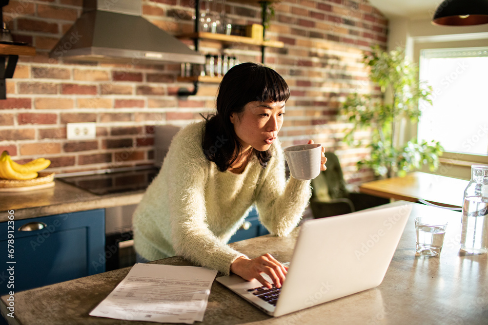 Focused Woman Working from Home with Coffee Focused Woman Working from Home with Coffee