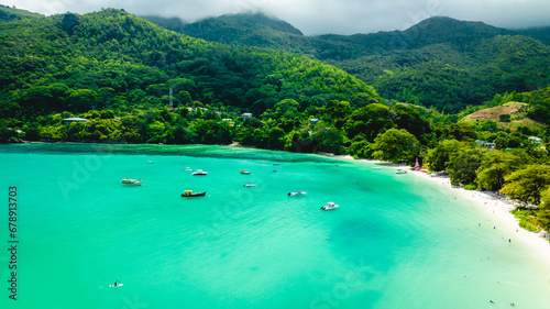 Praslin Seychelles tropical island with withe beaches and palm trees. Top view of a beautiful bay in the Indian Ocean with turquoise crystal clear waters