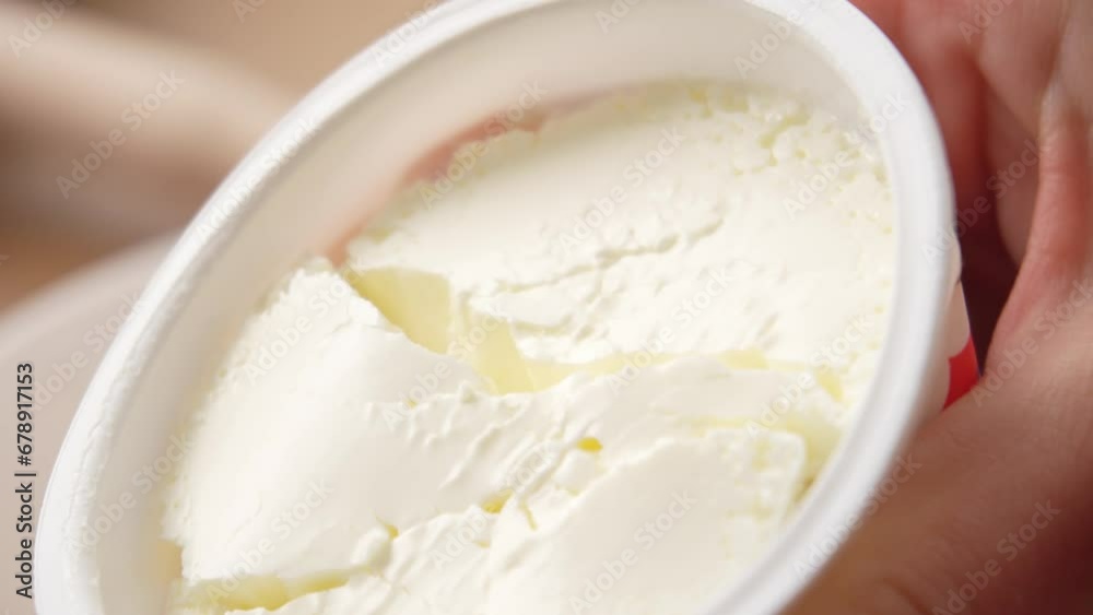 Fresh Dairy Cream Cheese in Container Close-up. Fresh Dairy Cream Cheese in Container Close-up.