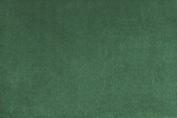 Texture background of velours green fabric. Upholstery texture fabric, velvet furniture textile material, design interior, decor. Fleecy fabric texture close up, backdrop, wallpaper.