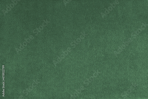 Texture background of velours green fabric. Upholstery texture fabric, velvet furniture textile material, design interior, decor. Fleecy fabric texture close up, backdrop, wallpaper.