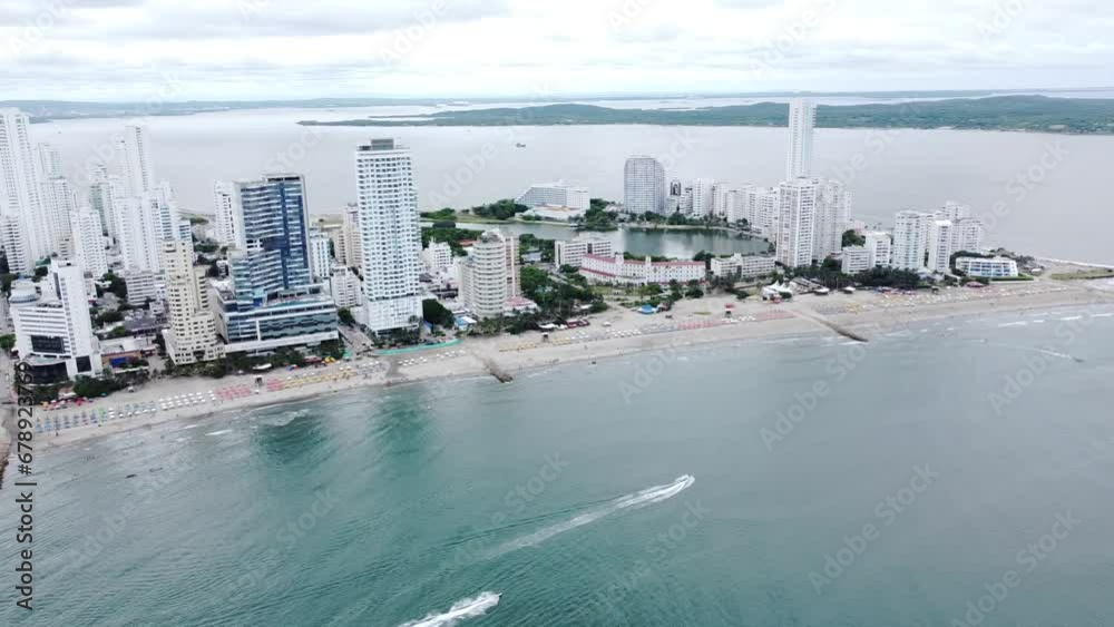 Aerial video of the white tall buildings on the shore on the sea on a sunny day Aerial video of the white tall buildings on the shore on the sea on a sunny day