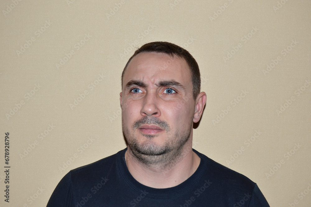 Obraz premium portrait of a young handsome man with blue eyes, light stubble and various emotions. young people leading a healthy lifestyle, open to communication, positive and friendly