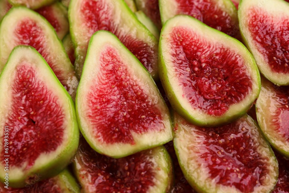Pieces of fresh green figs as background, top view Pieces of fresh green figs as background, top view