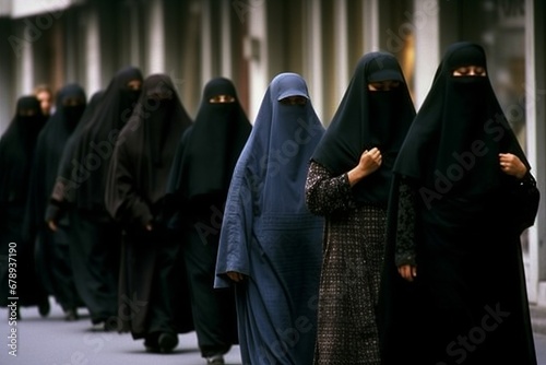 line of many arab women wearing burka; traditional clothing of arabic religion islam