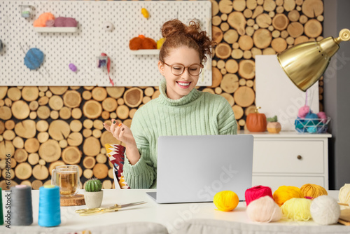 Young woman with laptop and...
