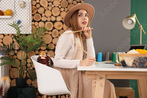 Thoughtful young woman with...