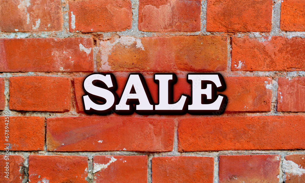 Obraz premium ビンテージなレンガの背景に、SALEのロゴがある広告の素材