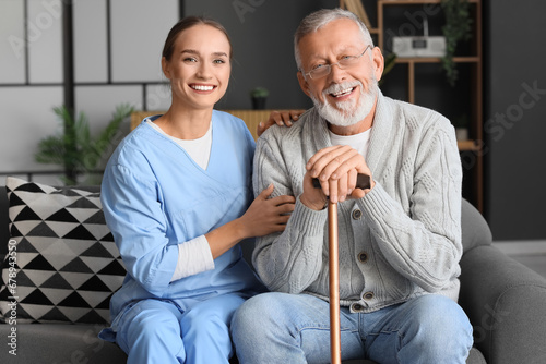 Senior man with stick and n...