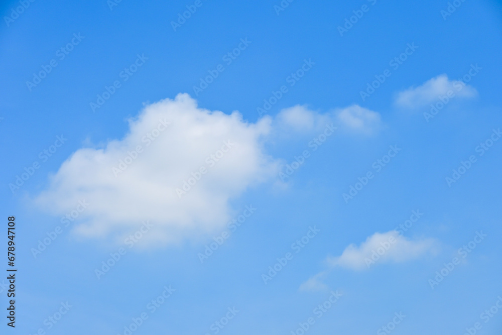 beautiful blue sky and white fluffy group of clouds with sunrise in the morning, natural background