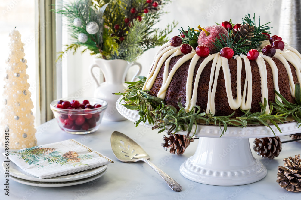 A decorated chocolate bundt cake with buttercream frosting, ready for serving.