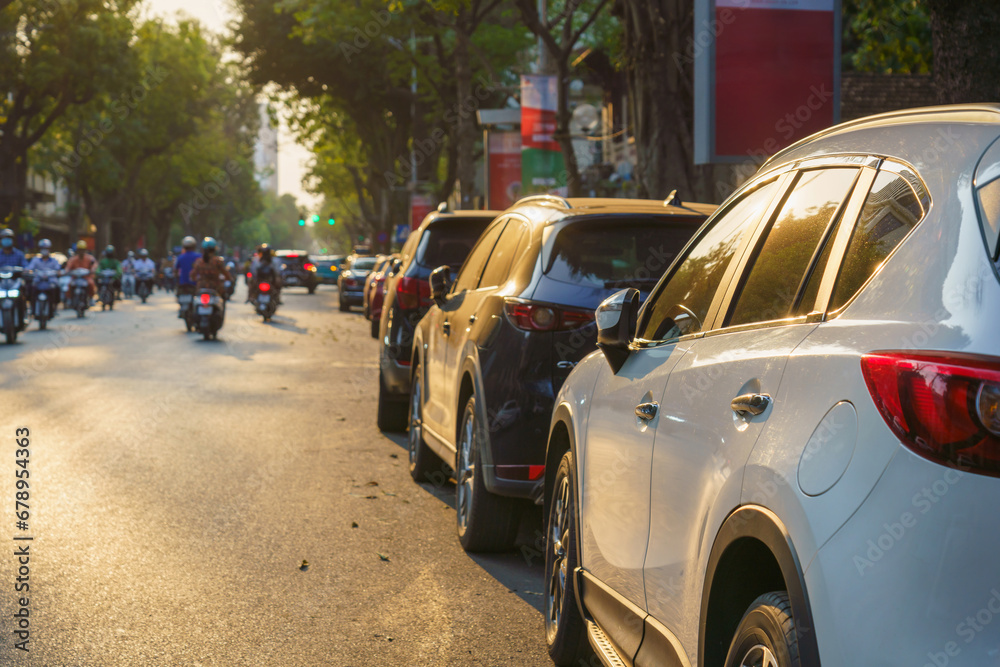 Rows of cars parked on the roadside in Hanoi street