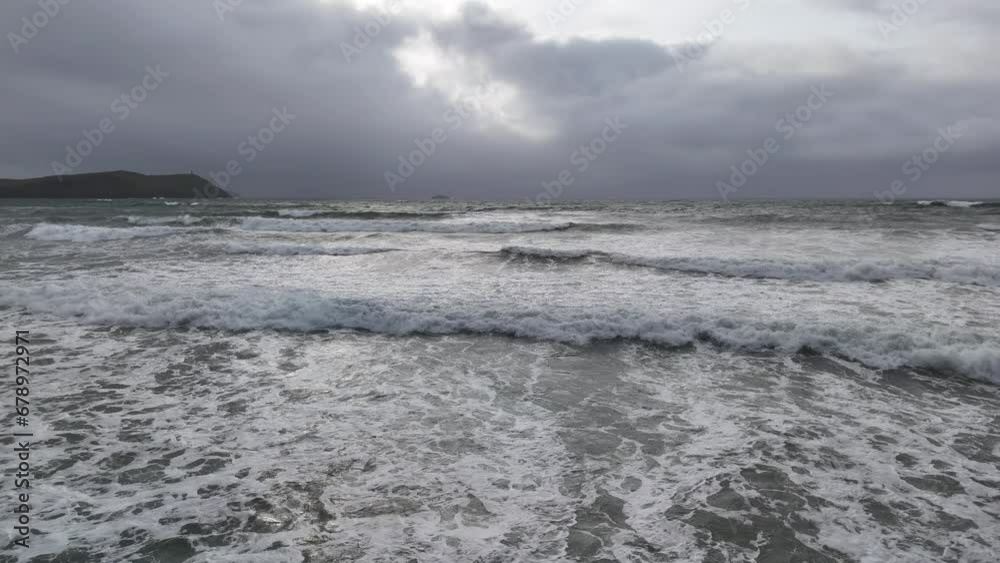 Low drone over waves in sea stormy sky in background Low drone over waves in sea stormy sky in background