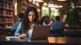 Student, female and portrait of a young girl working, doing an assignment or researching on a laptop in a school or college library. Confident, Indian, female teen doing homework in an information ce