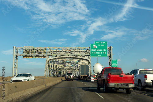 cars crossing the Mississippi at Baton Rouge at the old historic Horace Wilkinson bridge in Baton Rouge, Louisiana photo