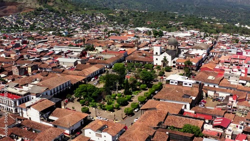 DRONE SHOT OF TACAMBARO MICHOACAN MAIN PLAZA AT MID DAY photo