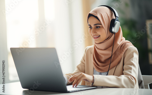 Portrait of an Islamic lady having a video call on a laptop