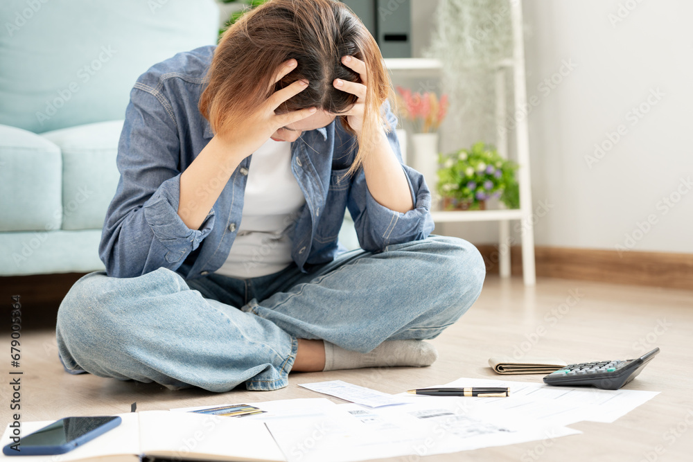 Stressed and headache asian woman with large bills or invoices no money to pay to expenses and credit card debt. shortage, Financial problems, mortgage, loan, bankruptcy, bankrupt, poor, empty wallet Stressed and headache asian woman with large bills or invoices no money to pay to expenses and credit card debt. shortage, Financial problems, mortgage, loan, bankruptcy, bankrupt, poor, empty wallet