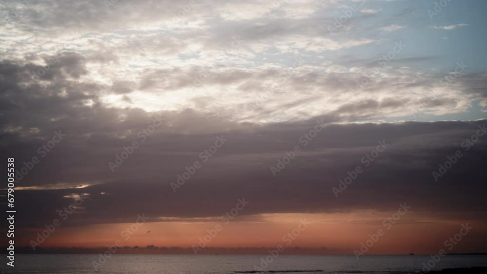 Seascape at morning. Time lapse of clouds moving over sea, sunlight on horizon. Seascape at morning. Time lapse of clouds moving over sea, sunlight on horizon.