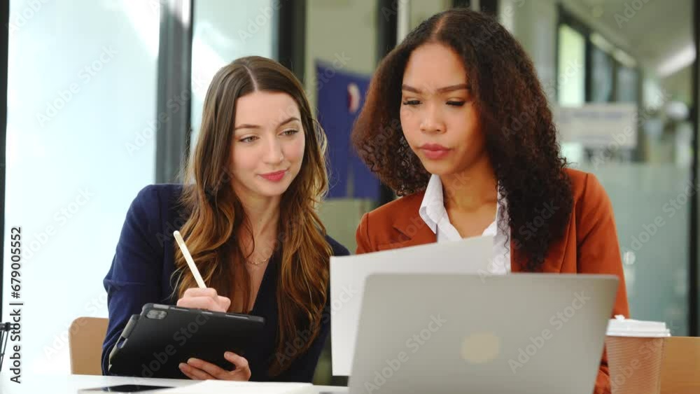 Two professional caucasian with african american businesswoman friends collaboration, working together at office, using laptop, Generally accepted audit standards, Earnings before interest and taxes Two professional caucasian with african american businesswoman friends collaboration, working together at office, using laptop, Generally accepted audit standards, Earnings before interest and taxes