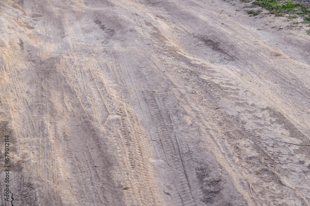 Fototapeta premium dusty dirt road at summer day, full-frame closeup view