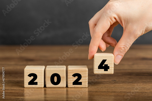 2024 on Wooden Block. Merry Christmas and Happy New Year, 2024 new year idea concept. Going in toward 2024