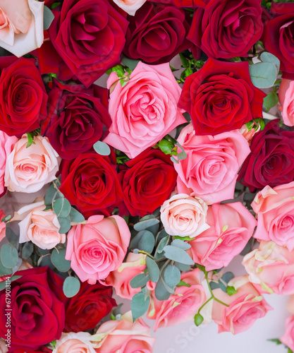 Backdrop of red and pink roses Flowers wall background Wedding decoration