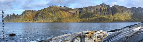 beautiful panorama with peak mountains  devil's teeth and sea  in Senja island in Norway photo