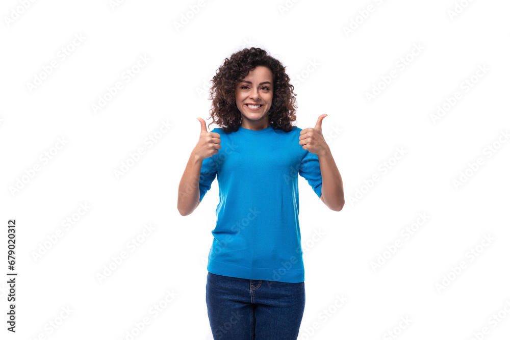 young woman with curly natural hair style dressed in a blue sweater young woman with curly natural hair style dressed in a blue sweater
