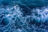 Seascape from high perspective. Top view of ocean sea water splashing.