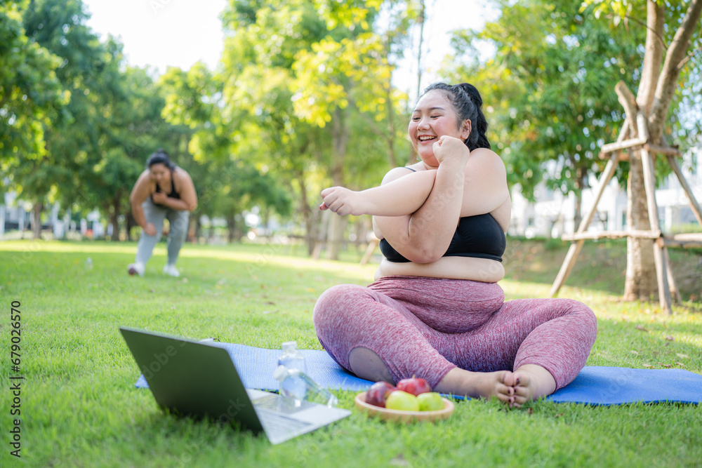 Happy plus size asian woman practicing yoga in garden. Healthy lifestyle and relaxation concept.Young Asian Girl doing yoga in the park. Happy plus size asian woman practicing yoga in garden. Healthy lifestyle and relaxation concept.Young Asian Girl doing yoga in the park.