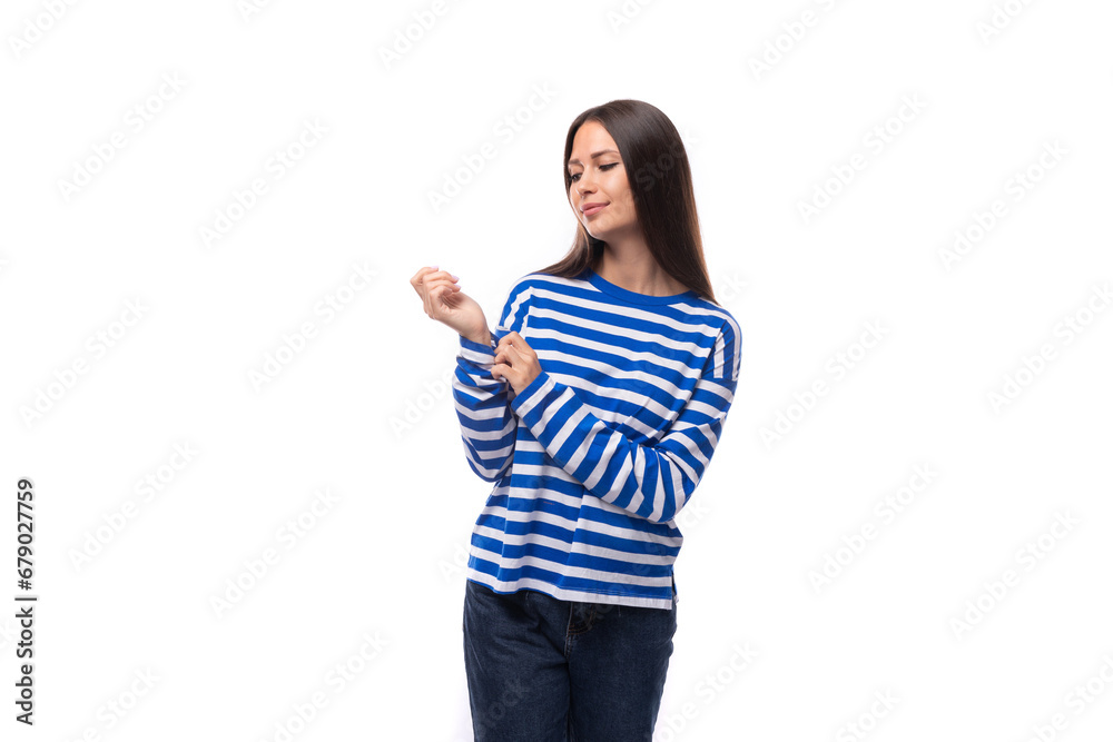 young charming brunette lady with straight hair is dressed in a blue blouse on a white background with copy space young charming brunette lady with straight hair is dressed in a blue blouse on a white background with copy space