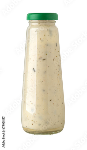 Glass bottle of white sauce.
