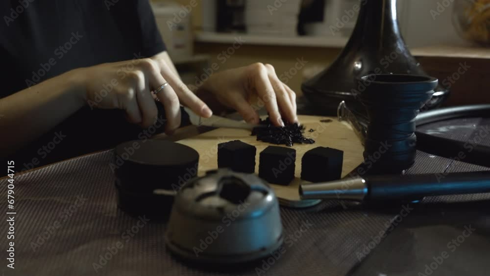 a girl cooks a hookah at home the process of making a hookah for smoking the concept of smoking a hookah and having a good time a girl cooks a hookah at home the process of making a hookah for smoking the concept of smoking a hookah and having a good time