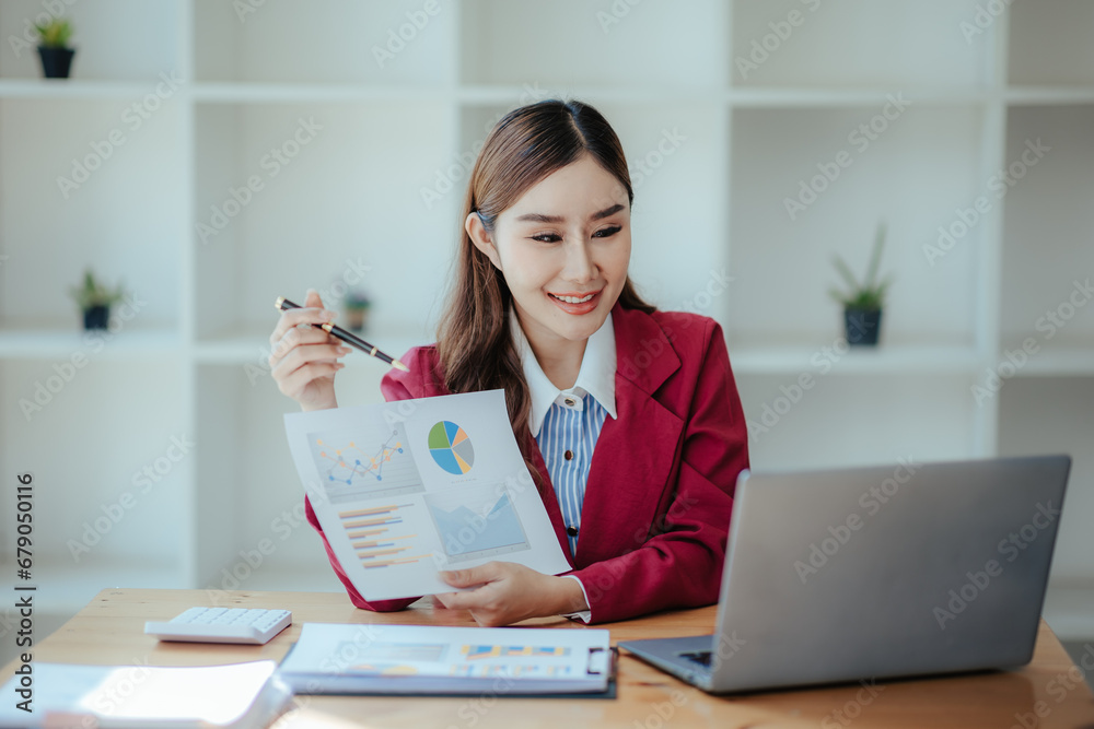Portrait of a happy beautiful Asian businesswoman.
Working with a tablet in a company office Portrait of a happy beautiful Asian businesswoman.
Working with a tablet in a company office