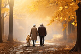 elderly couple with dog walking in the autumn forest
